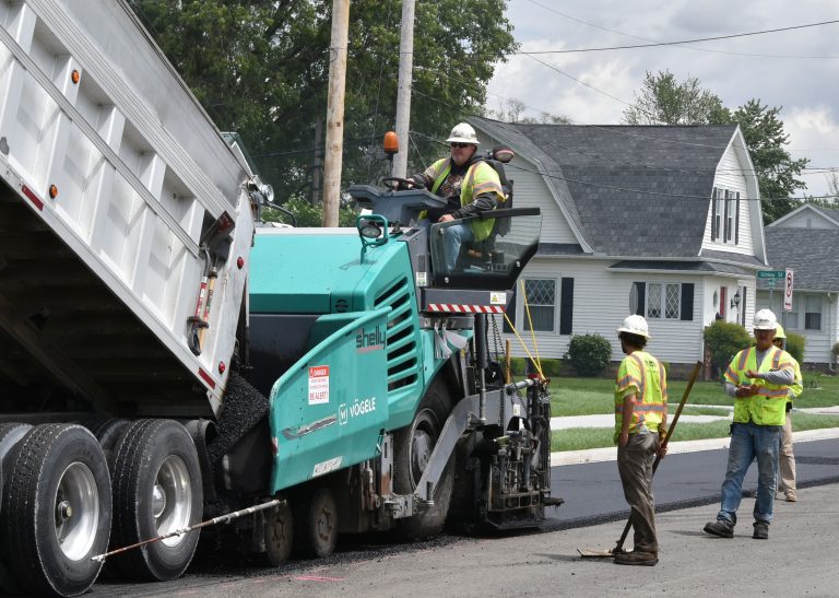 Shelly Company crews started adding a final layer of asphalt on Leeson Avenue on Friday. (Sam Shriver/CherryRoad Media)