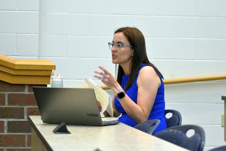 Lincolnview Schools Treasurer Kaitlyn Edelbrock gives board members an update on the district’s finances, addressing uncertainties in school funding at the state legislature. (Sam Shriver/CherryRoad Media)
