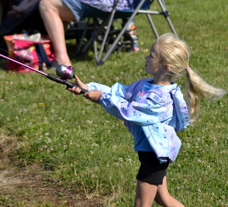 Phoebe Allison, 6, casts her line during Saturday’s Kids Fishing Tournament at Smiley Park. (Sam Shriver/CherryRoad Media)