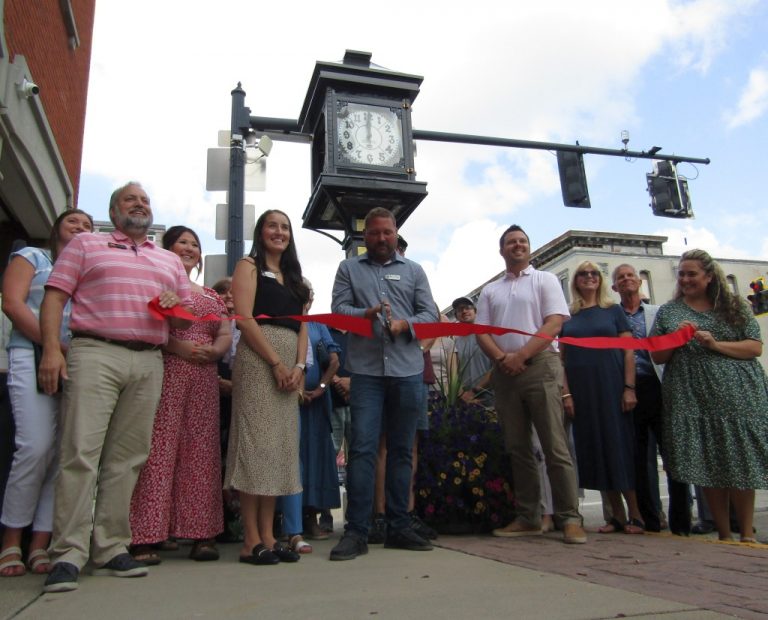 A Chamber of Commerce ribbon cutting ceremony marked the dedication of the refurbished National Bank clock in downtown Van Wert. Sadly, the clock needed more repairs. (Sam Shriver/CherryRoad Media)
