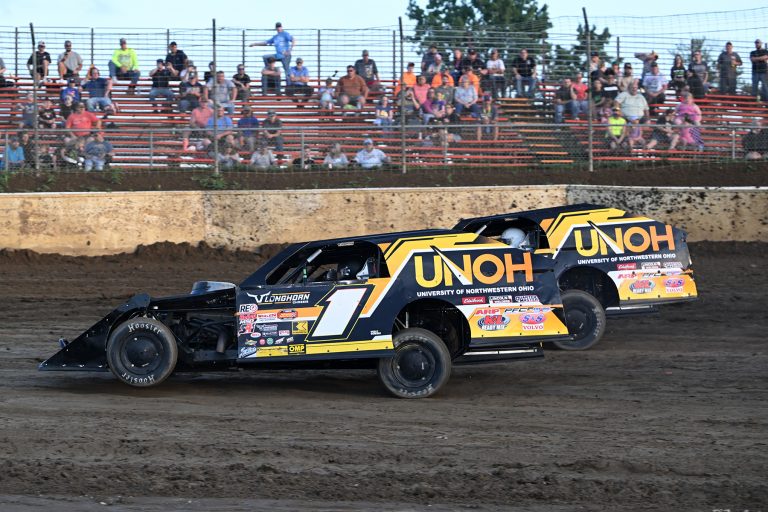 Eric Kinney (1) and Aidan Hinds race close in modified action at Limaland. (Photo Submitted)