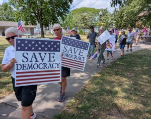 A small group of protesters made their way from Fountain Park to the Washington Street bridge to remember former civil rights leader John Lewis. (Sam Shriver/CherryRoad Media)