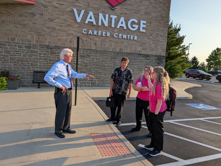 Vantage Career Center superintendent Rick Turner greets students as they arrive on the first day of school, Thursday. (Sam Shriver/CherryRoad Media)