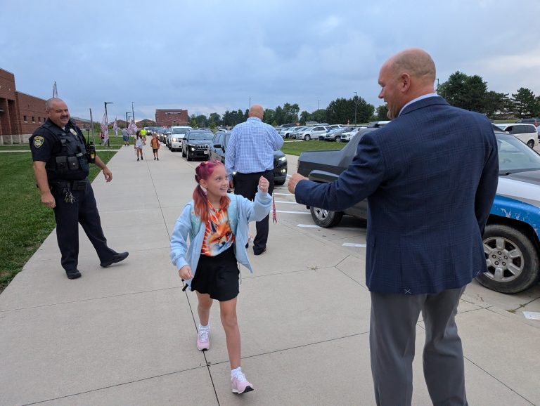 Van Wert Schools superintendent Mark Bagley greets students as they arrive Wednesday for the first day of school at Van Wert Elementary. (Sam Shriver/CherryRoad Media)