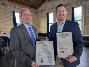 State Representative Roy Klopfenstein (left) and Seth Baker display proclamations from the Ohio House and Senate, marking 100 years for the Van Wert County Foundation. (Sam Shriver/CherryRoad Media)