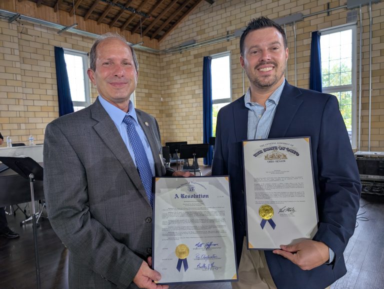 State Representative Roy Klopfenstein (left) and Seth Baker display proclamations from the Ohio House and Senate, marking 100 years for the Van Wert County Foundation. (Sam Shriver/CherryRoad Media)