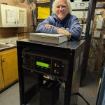 WERT owner Chris Roberts stands behind the new AM transmitter. (Sam Shriver/CherryRoad Media)