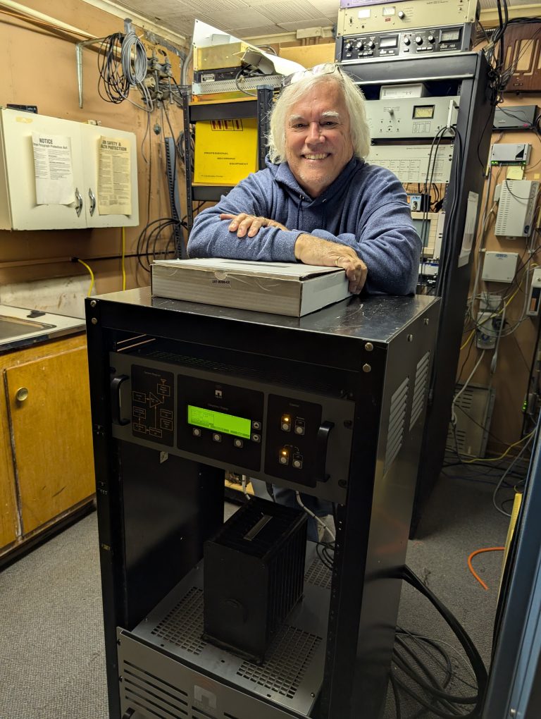 WERT owner Chris Roberts stands behind the new AM transmitter. (Sam Shriver/CherryRoad Media)