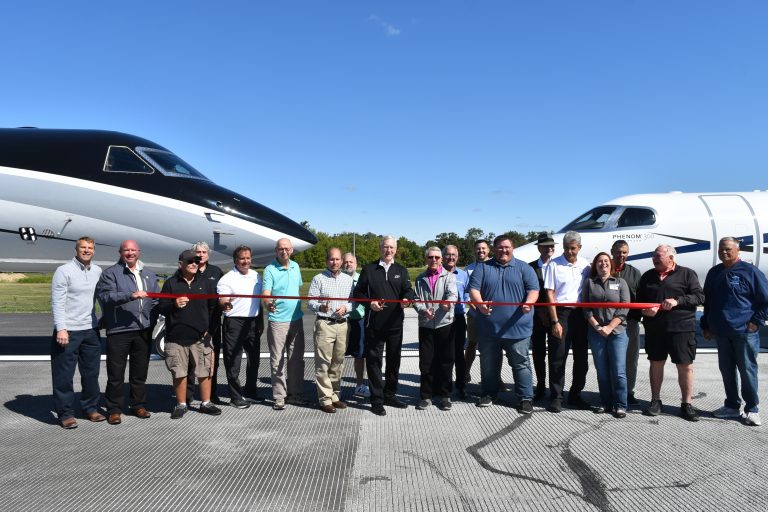 Local dignitaries joined airport personnel to cut the ribbon, officially dedicating a 1,000 ft. runway extension. (Sam Shriver/CherryRoad Media)