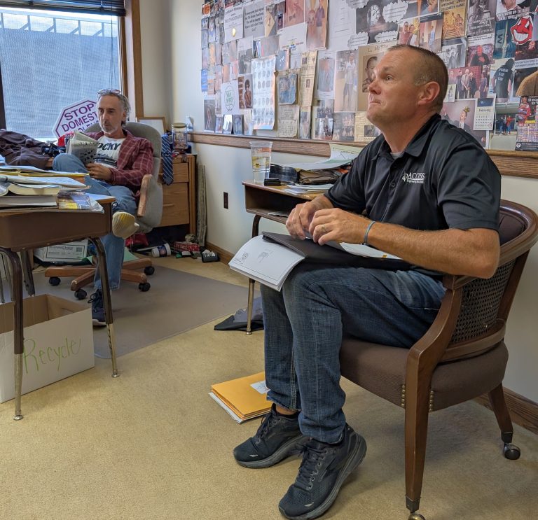 Van Wert County Commissioner Todd Wolfrum (left) and Craig Knapke with Access Engineering discuss awarding a contract for a waterline project in Middle Point. (Sam Shriver/CherryRoad Media)