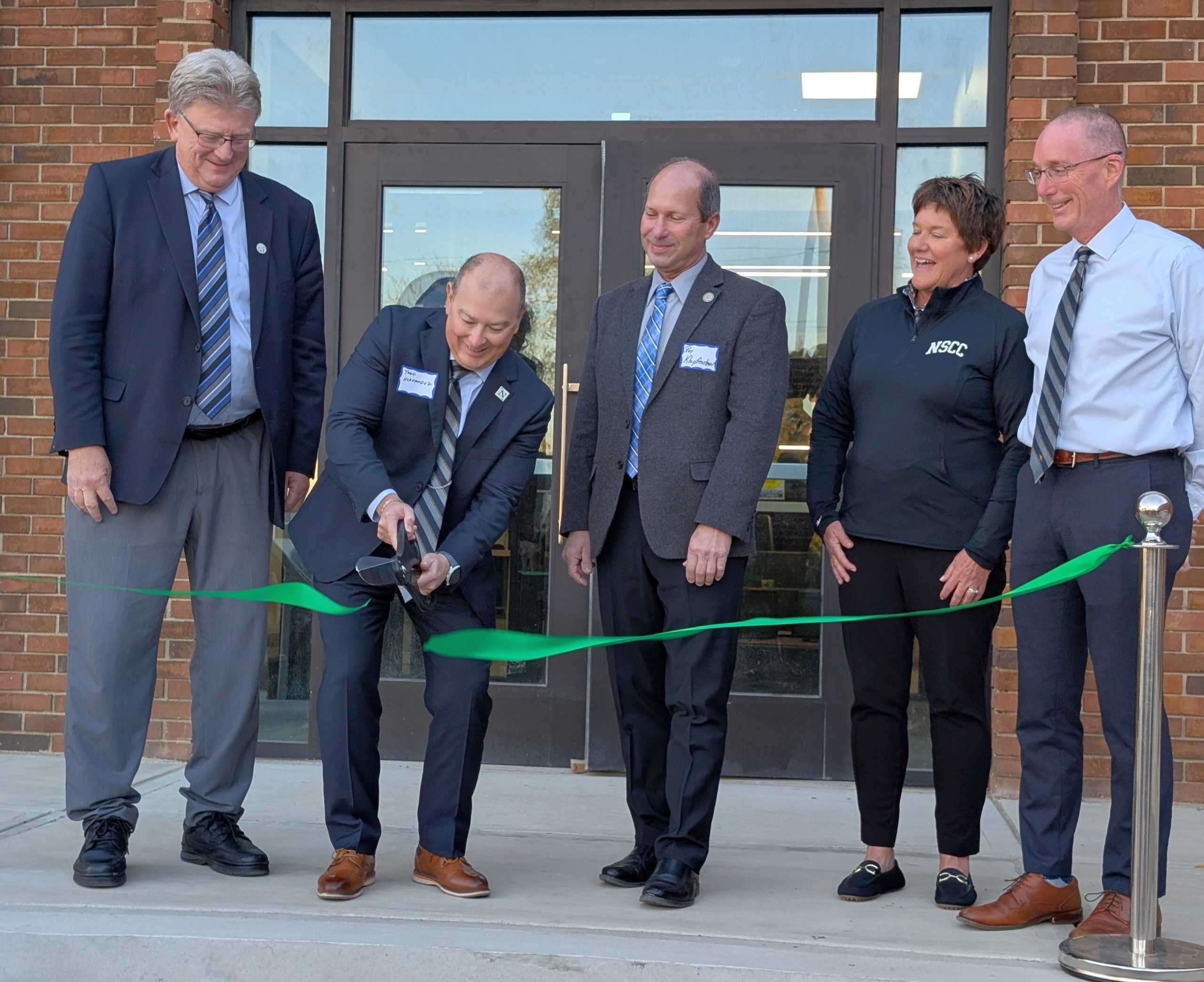 Northwest State Community College President Todd Hernandez cuts the ribbon on the new Van Wert Campus. (Sam Shriver/CherryRoad Media)